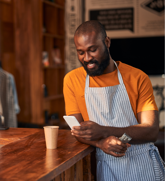 cheerful man pressing phone